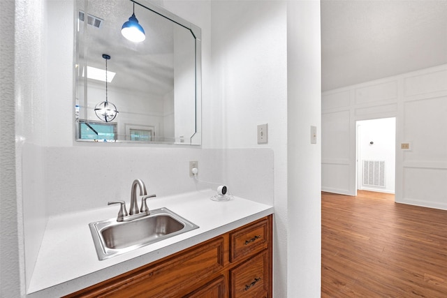 bathroom featuring vanity and hardwood / wood-style floors