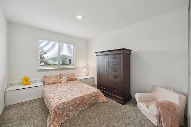 bedroom with carpet floors and baseboards