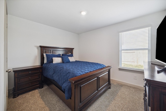 bedroom featuring carpet flooring and baseboards