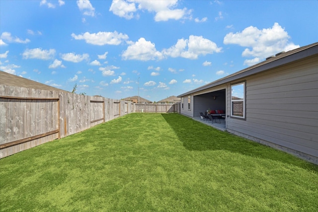 view of yard with a fenced backyard and a patio