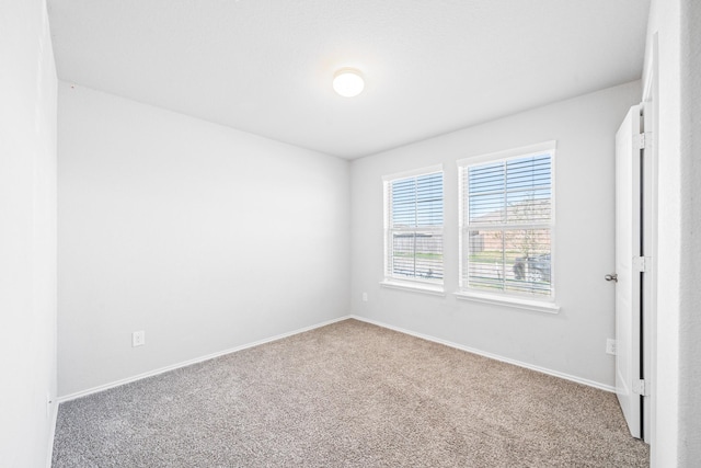 spare room featuring carpet flooring