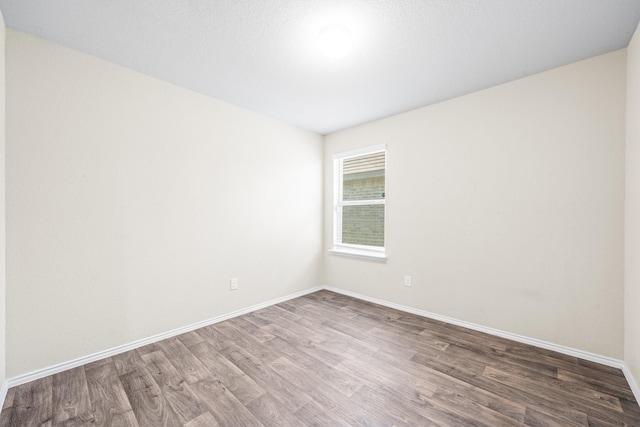 unfurnished room featuring wood-type flooring