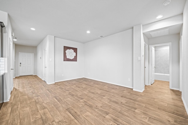 unfurnished living room with light hardwood / wood-style flooring