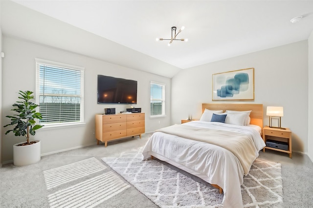 bedroom featuring lofted ceiling, light colored carpet, and a notable chandelier