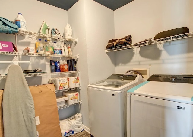 laundry room with washing machine and clothes dryer