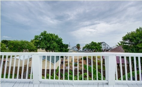 view of gate with a wooden deck