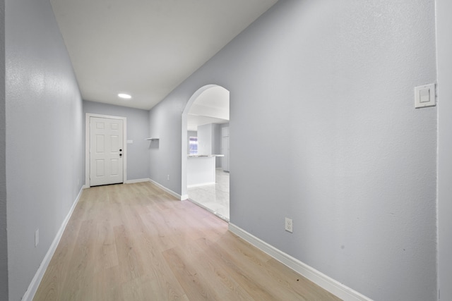 hallway with light wood-type flooring