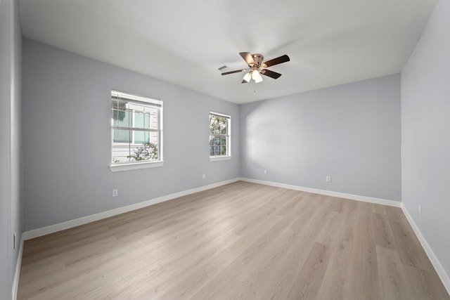 unfurnished room featuring ceiling fan and light hardwood / wood-style flooring