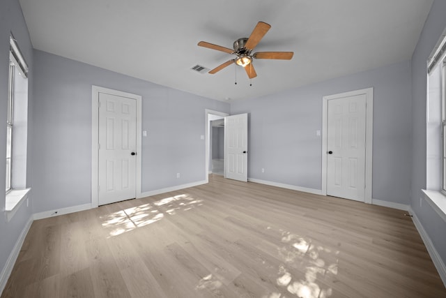 unfurnished bedroom featuring ceiling fan and light wood-type flooring