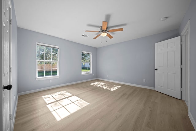 unfurnished room with ceiling fan and light hardwood / wood-style flooring