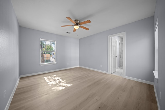 unfurnished room with ceiling fan and light hardwood / wood-style floors