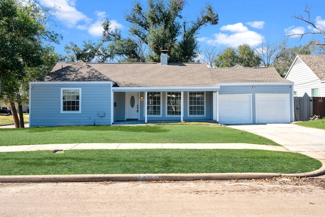 single story home featuring a front lawn and a garage