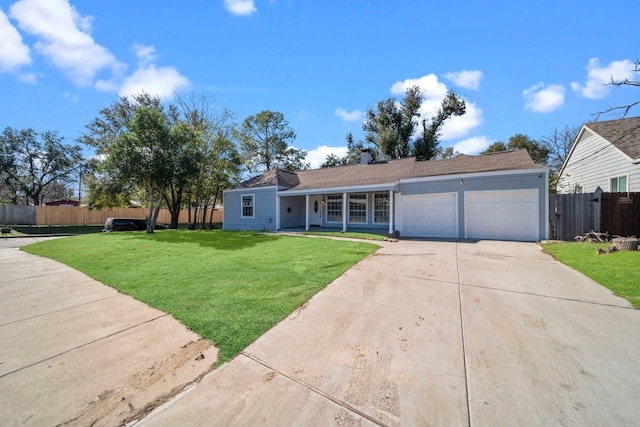 ranch-style home featuring a garage and a front yard