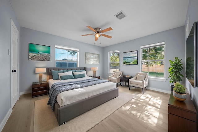 bedroom featuring ceiling fan and light hardwood / wood-style flooring