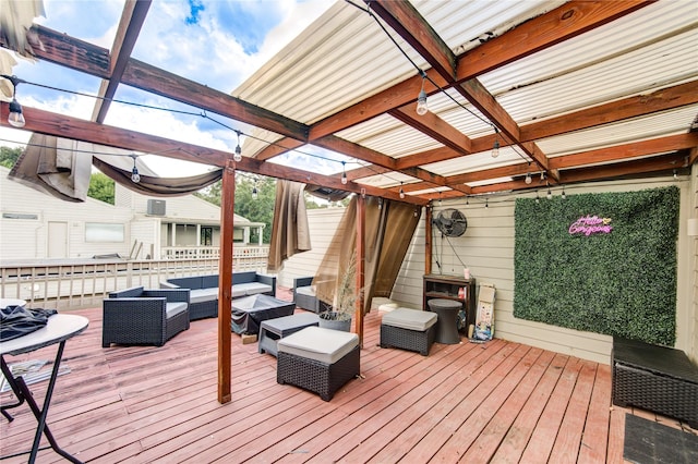 wooden deck featuring an outdoor living space