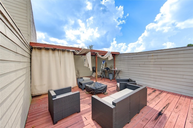 wooden terrace featuring an outdoor hangout area