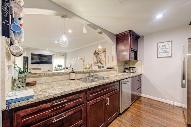 kitchen with sink, hanging light fixtures, stainless steel appliances, dark hardwood / wood-style flooring, and light stone counters