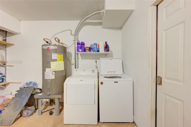 laundry room with electric water heater and washing machine and clothes dryer