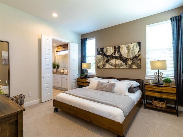 carpeted bedroom with ensuite bathroom