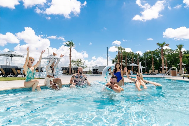 view of swimming pool featuring pool water feature