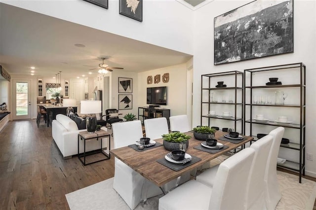 dining room featuring hardwood / wood-style floors and ceiling fan