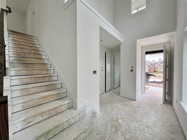 foyer entrance with a high ceiling