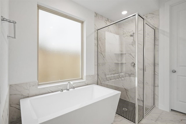 7462 Cattail Falls Ln, Porter, TX 77365 - bathroom with marble finish flooring, a marble finish shower, tile walls, a freestanding tub, and recessed lighting