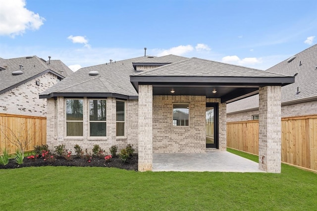 7462 Cattail Falls Ln, Porter, TX 77365 - back of property with a patio area, a shingled roof, and brick siding