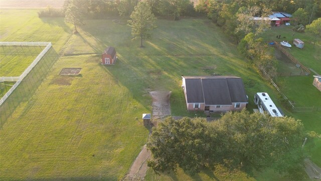 birds eye view of property with a rural view