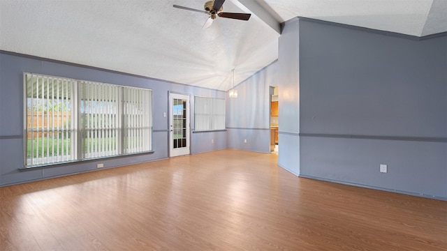 unfurnished living room featuring hardwood / wood-style flooring, a textured ceiling, ceiling fan with notable chandelier, and vaulted ceiling with beams