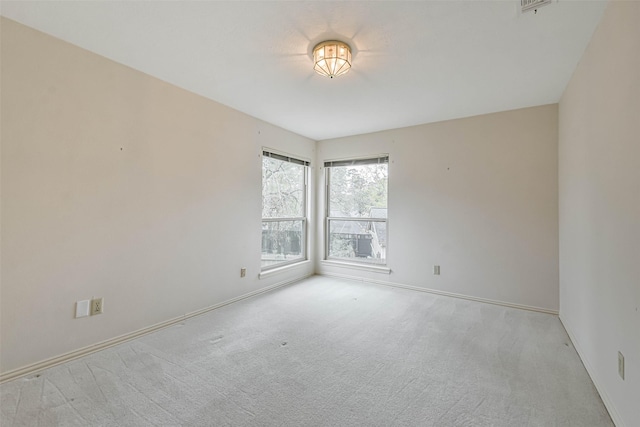 empty room with light colored carpet