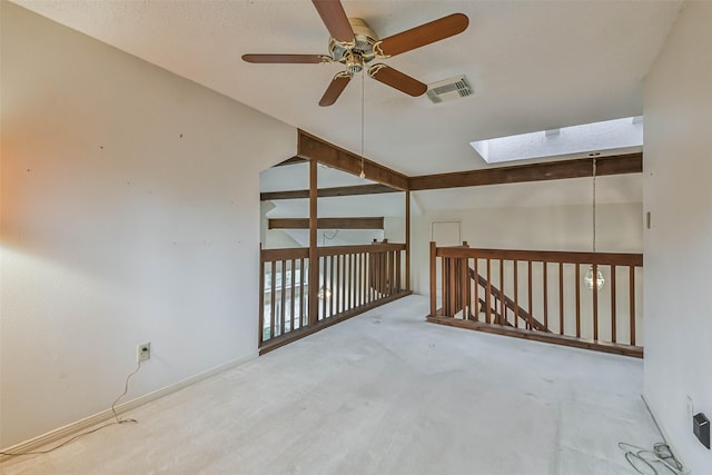 bonus room with ceiling fan, carpet, and lofted ceiling with skylight