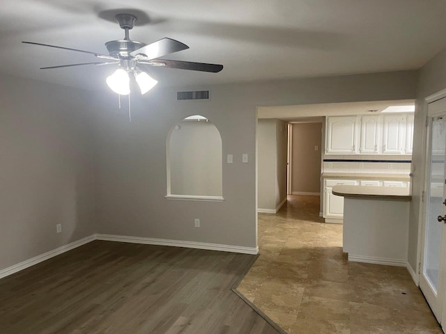 spare room with ceiling fan and hardwood / wood-style floors