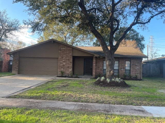 ranch-style house featuring a garage and a front yard