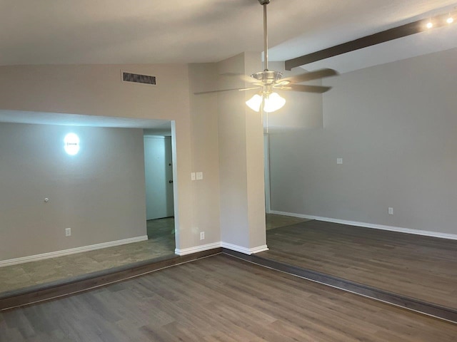 unfurnished room featuring lofted ceiling, ceiling fan, and dark hardwood / wood-style flooring