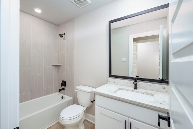 full bathroom with toilet, vanity, and shower / tub combination