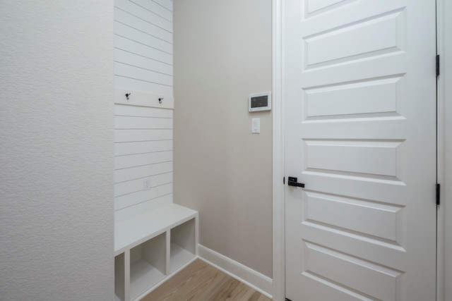 mudroom with light hardwood / wood-style flooring