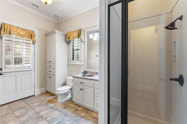 bathroom with toilet, crown molding, walk in shower, and vanity