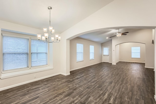 interior space featuring vaulted ceiling, dark hardwood / wood-style flooring, ceiling fan with notable chandelier, and plenty of natural light