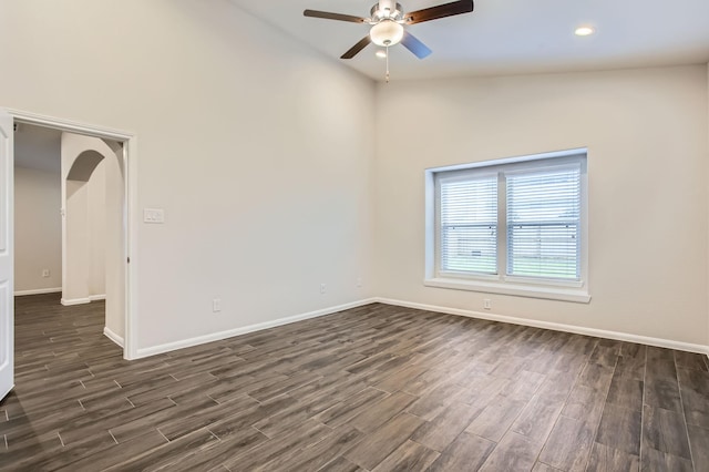 empty room with ceiling fan and vaulted ceiling