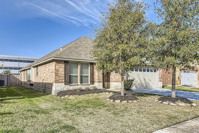 view of front of home with central AC unit, a garage, and a front yard