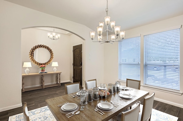 7535 Cypress Pin Oak Dr, Cypress, TX 77433 - dining area featuring vaulted ceiling, wood finished floors, baseboards, arched walkways, and an inviting chandelier