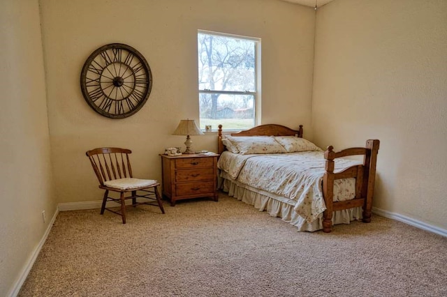 carpeted bedroom with baseboards