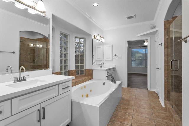 bathroom featuring separate shower and tub, vanity, tile patterned floors, and crown molding