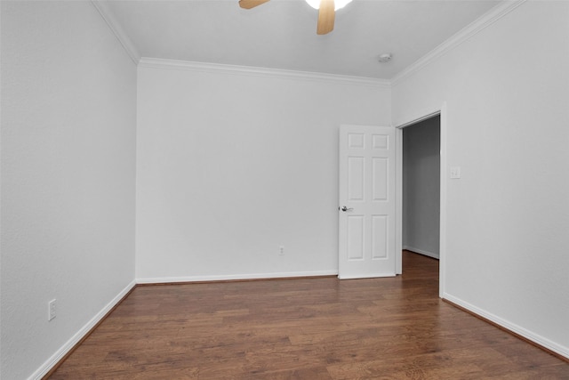 empty room with ceiling fan, dark hardwood / wood-style floors, and crown molding