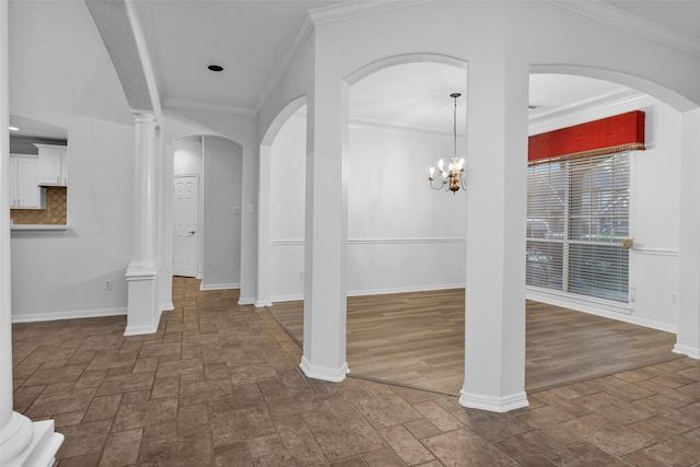 interior space with an inviting chandelier and ornamental molding