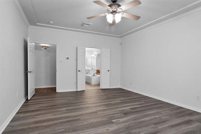 unfurnished bedroom with ensuite bath, ceiling fan, dark hardwood / wood-style flooring, and crown molding