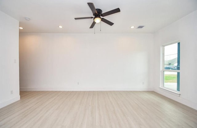 unfurnished room featuring ceiling fan and light wood-type flooring