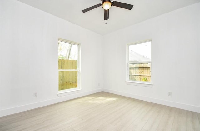 unfurnished room with ceiling fan and light hardwood / wood-style flooring