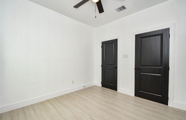 unfurnished bedroom with ceiling fan and light hardwood / wood-style flooring